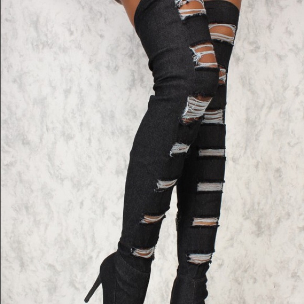 Distressed Over the knee pointed toe boots.